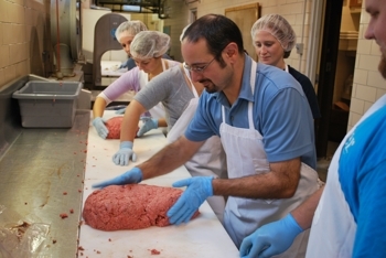 Dr. Mancini with students in the meat lab